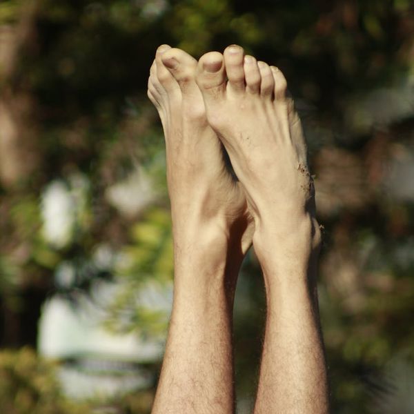 Person stretching peacefully with a calm background.