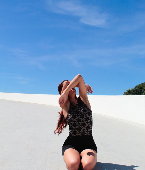 Woman feeling serene and energetic in a bright space.